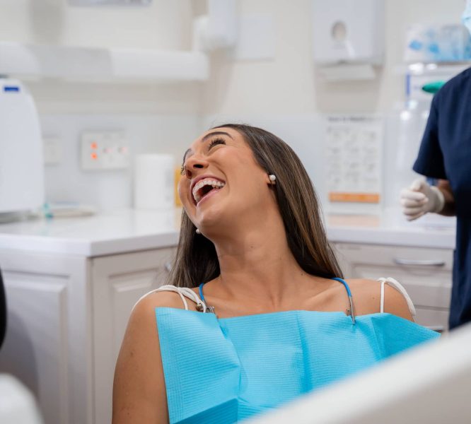 Dental patient laughing in dental seat