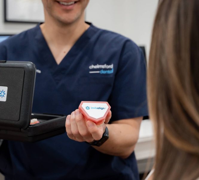 dentist holding invisalign container