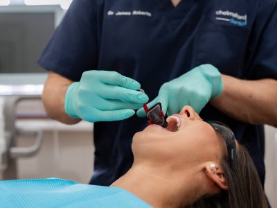 Dr. James from Chelmsford Dental preparing a dental bridge procedure with a patient