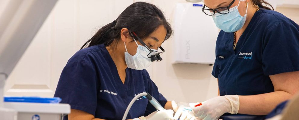 Dentist putting in a dental bridge